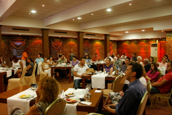 Participants listen to the evening lecture