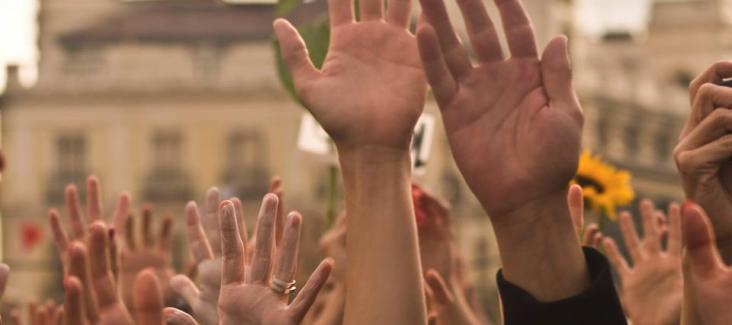 Raised hands in support for the ECI