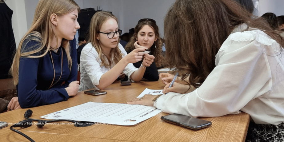 Photo of young people working together on an idea