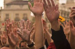 Raised hands in support for the ECI