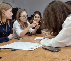 Photo of young people working together on an idea